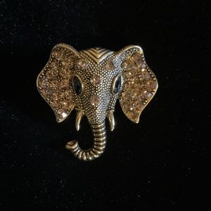 Charming black and gold elephant head brooch.